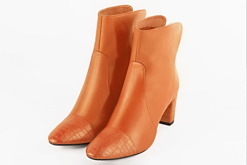 Apricot orange women's ankle boots with a zip at the back. Round toe. Medium block heels. Front view - Florence KOOIJMAN
